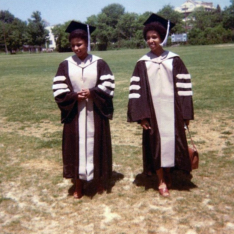two women in academic regalia