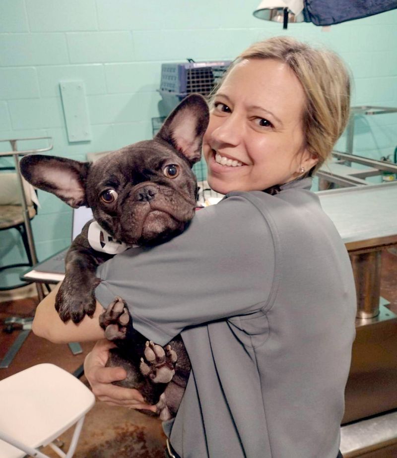 Ann Strain holding a lost frenchie.