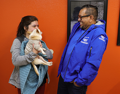Laura Guerrero and “Toby” chat with Robert at the North Figueroa Animal Hospital.