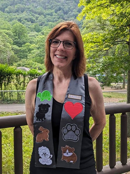 a woman wearing a stole with large animal patches