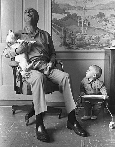 President Johnson singing a duet with Yuki while a toddler watches