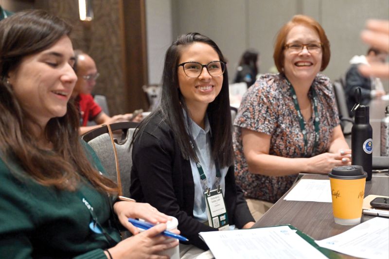 Three attendees enjoy an Expo workshop