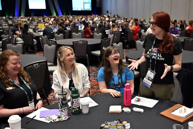 Group of people at a round table talking