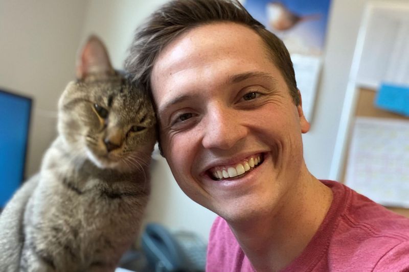 Garrett Parsons with Jaxton the cat