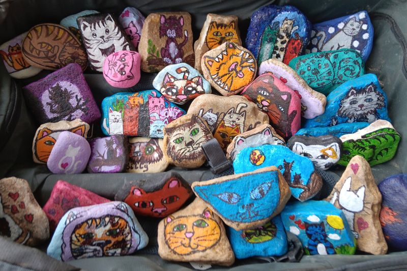 an assortment of colorful rocks painted with images of animals