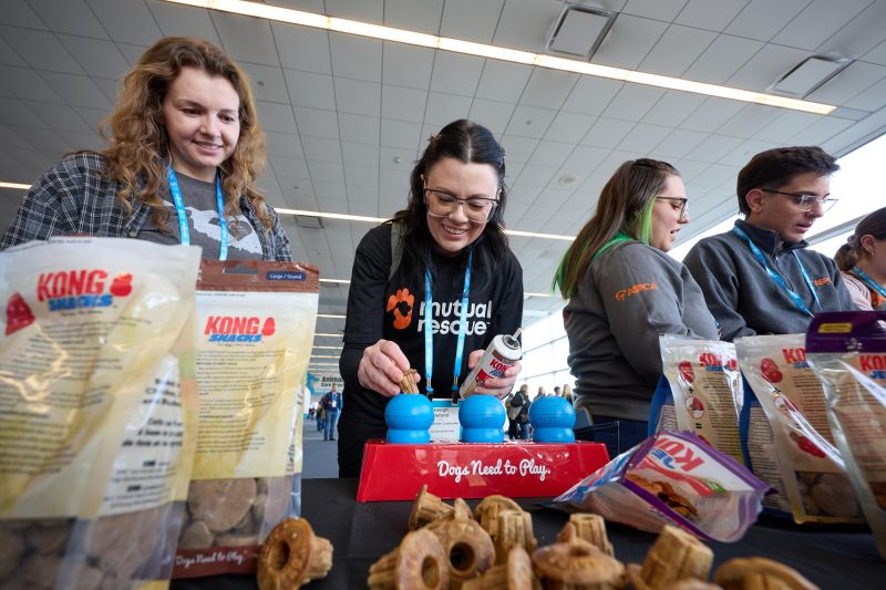 Attendees stuffing KONGs
