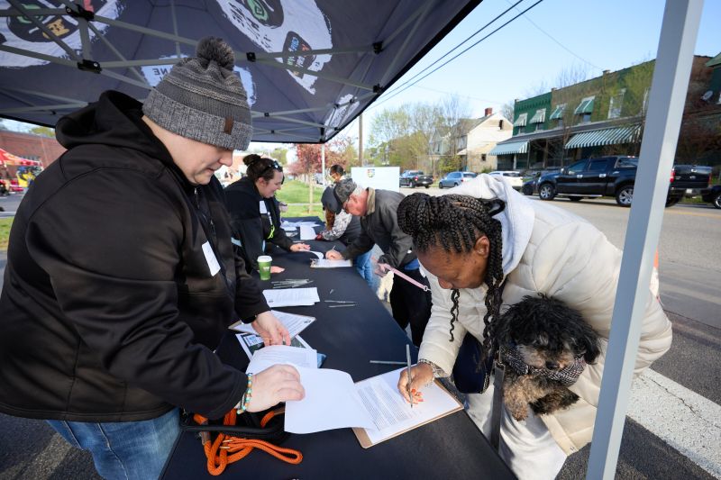 Volunteer helping someone with paperwork