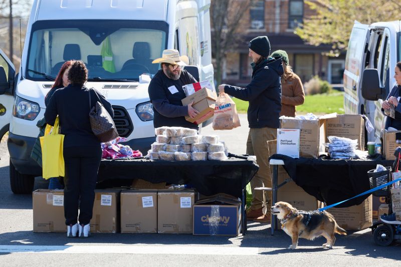Volunteers distributing food at CAWS Day