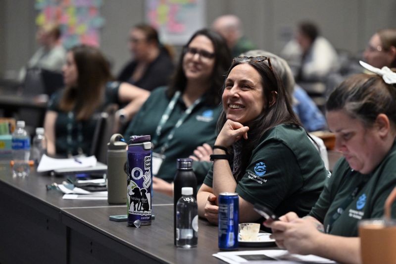 Attendees smiling in a workshop