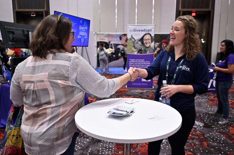 Two women shaking hands