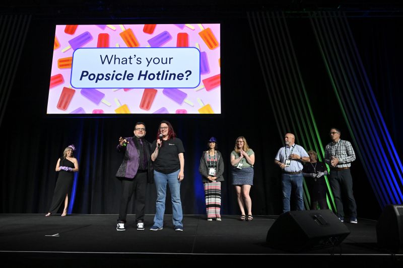 A group of people presenting on stage
