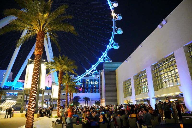 Party on the plaza with ferris wheel in background