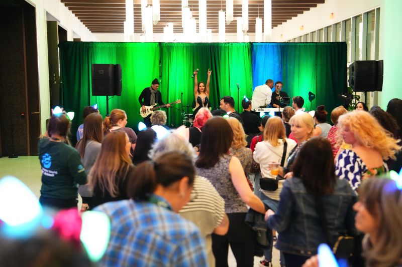 Band on stage with a crowd