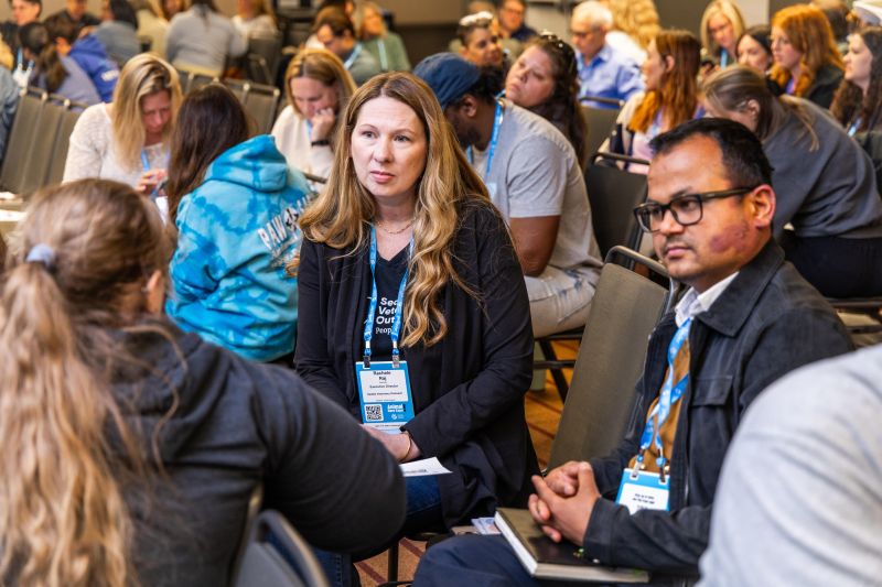Attendees in a workshop having a discussion
