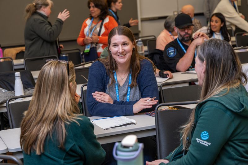 Attendees having a conversation in a workshop 