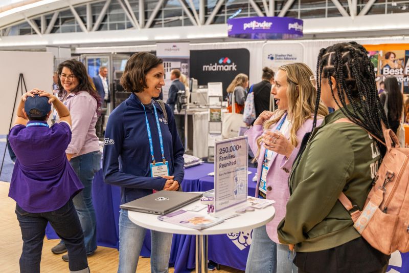 Exhibitors and attendees speaking