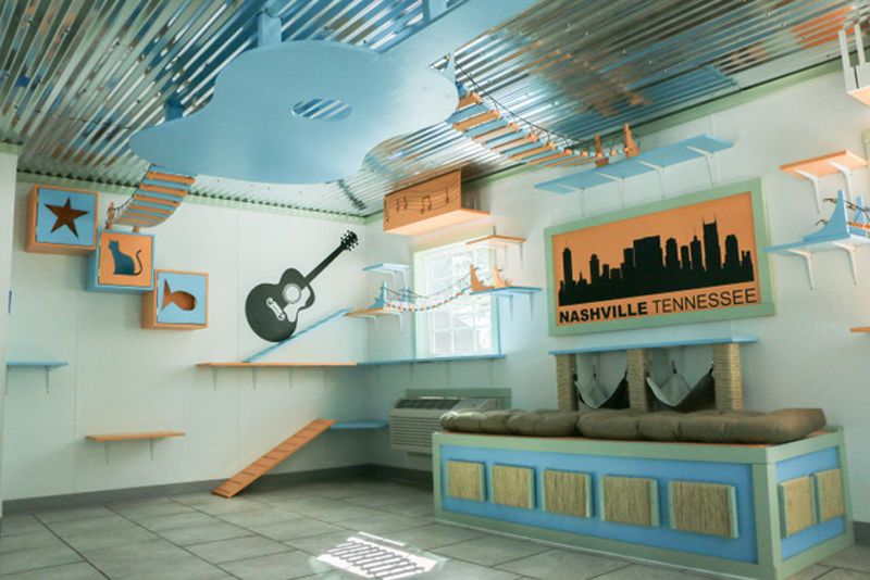 a remodeled shelter with guitars painted on the walls and a silhouette of nashville artwork