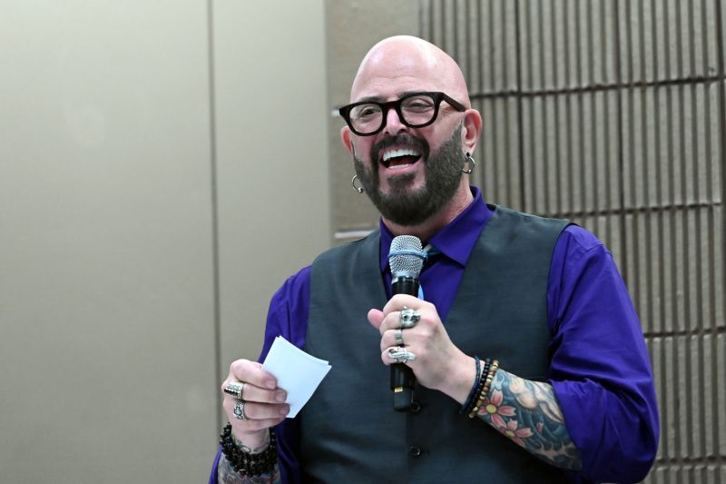 jackson galaxy holds a microphone