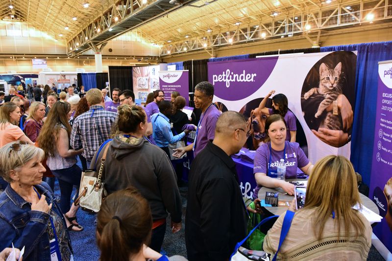 a croweded booth at animal care expo