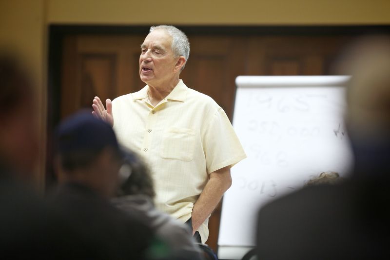 a man lecturing to a group of people