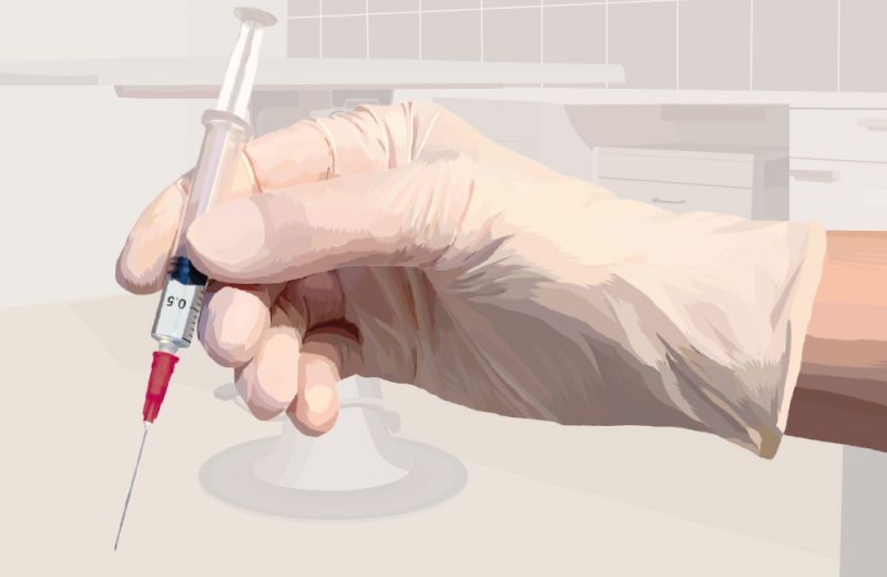 Illustration of a gloved hand holding a syringe