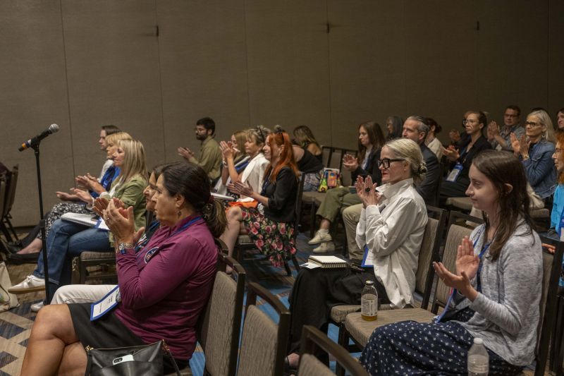 Workshop attendees clapping