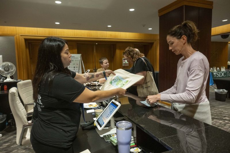 Attendee at registration desk