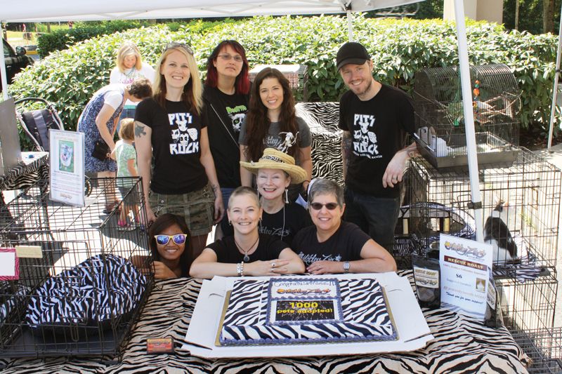 a group of people gathered benath a tent at an event