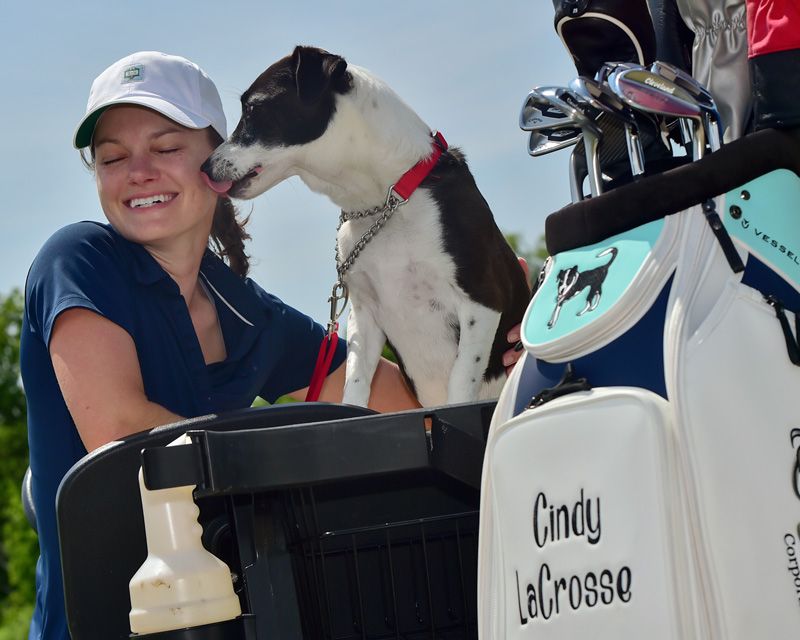 a dog licking a woman's face