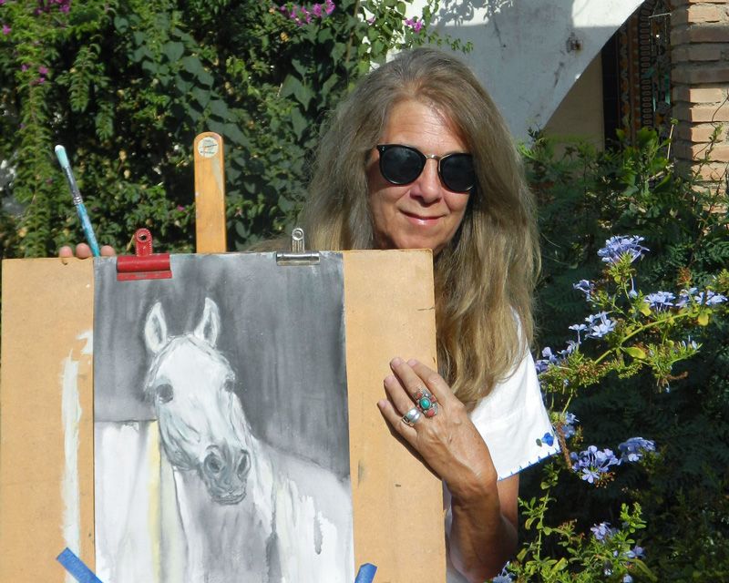 Didi Arias with her artwork
