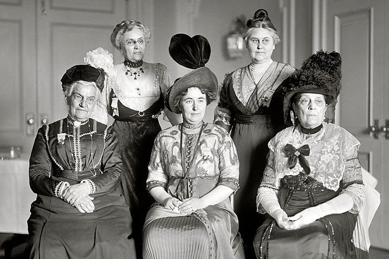 black and white photo of a group of women in old-fashioned dress