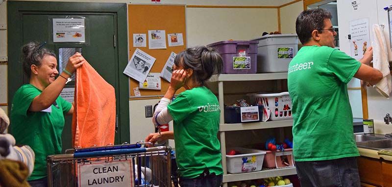 Photo of volunteers doing chores.