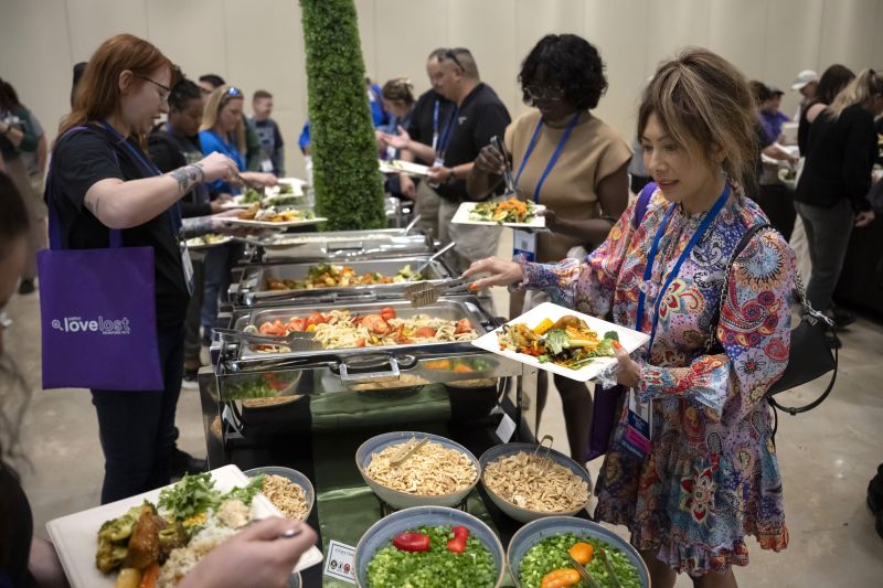 Attendees getting food at a buffet
