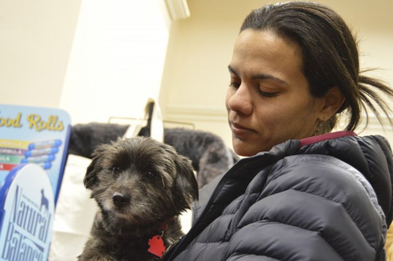 a woman holding her dog