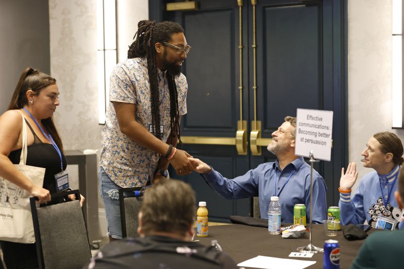 Attendees network during Round Tables session at TAFA 2025.