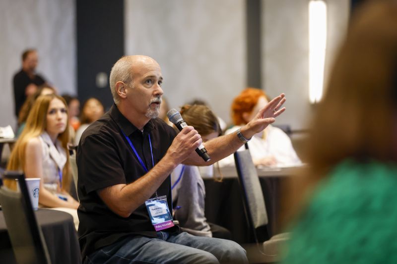 An attendee asks a question during a TAFA 2025 session.