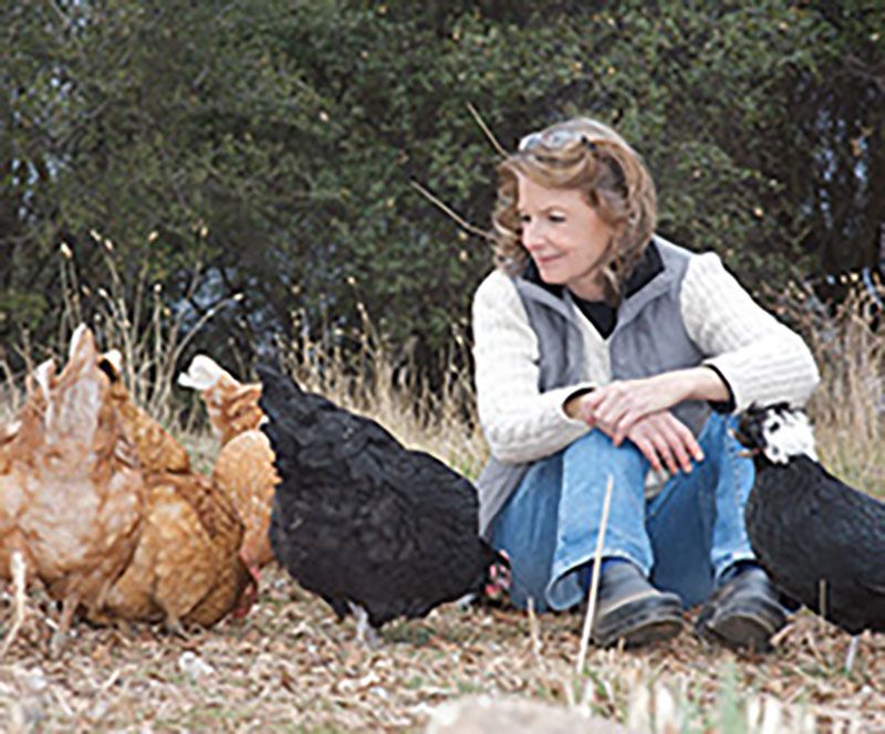 Kim Sturla, executive director of Animal Place, with chickens