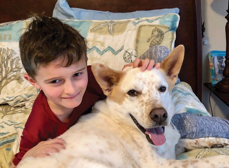 Nathan Housley enjoys cuddle time with Scout