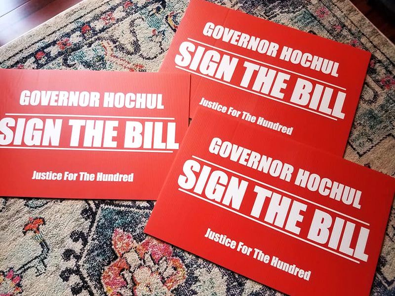 red post cards that read sign the bill