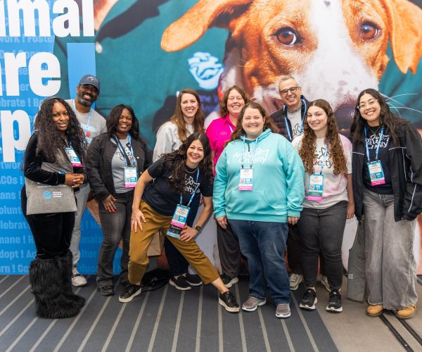 Group of attendees in front of an Expo sign
