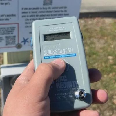 a person presses a button on a scanning device