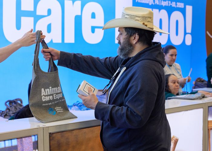 Attendee being handed an Expo bag