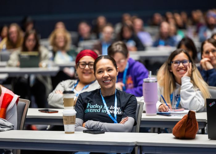 Attendees at a workshop smiling