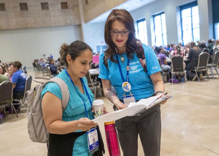 Volunteer helping an attendee
