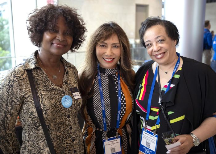 A group of attendees smiling at the camera