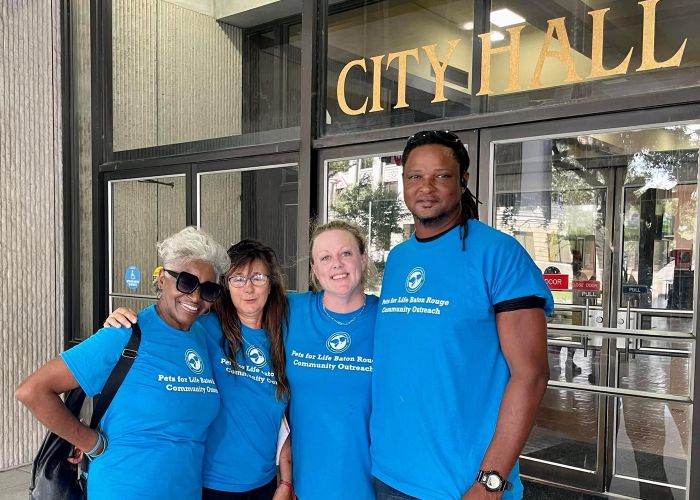 Pets for Life Baton Rouge community outreach advocates standing in front of City Hall