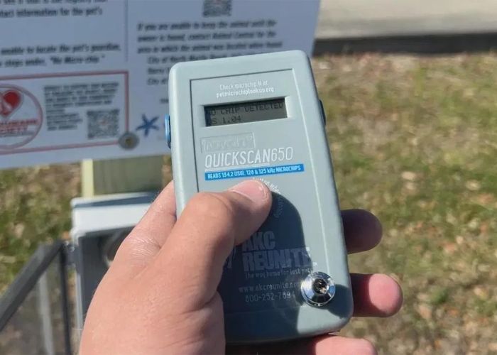 a person presses a button on a scanning device