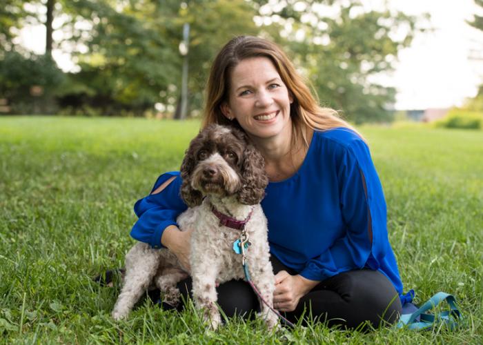 Amy Nichols poses with her dog Finnegan