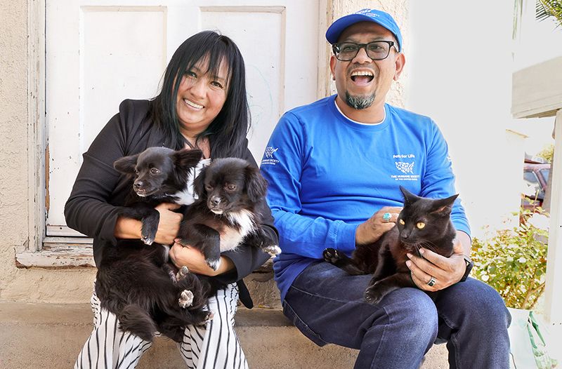 Robert visits Karina Lopez during a community outreach event.